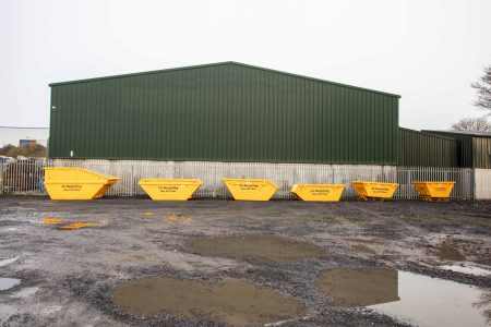 Row of yellow skips for hire